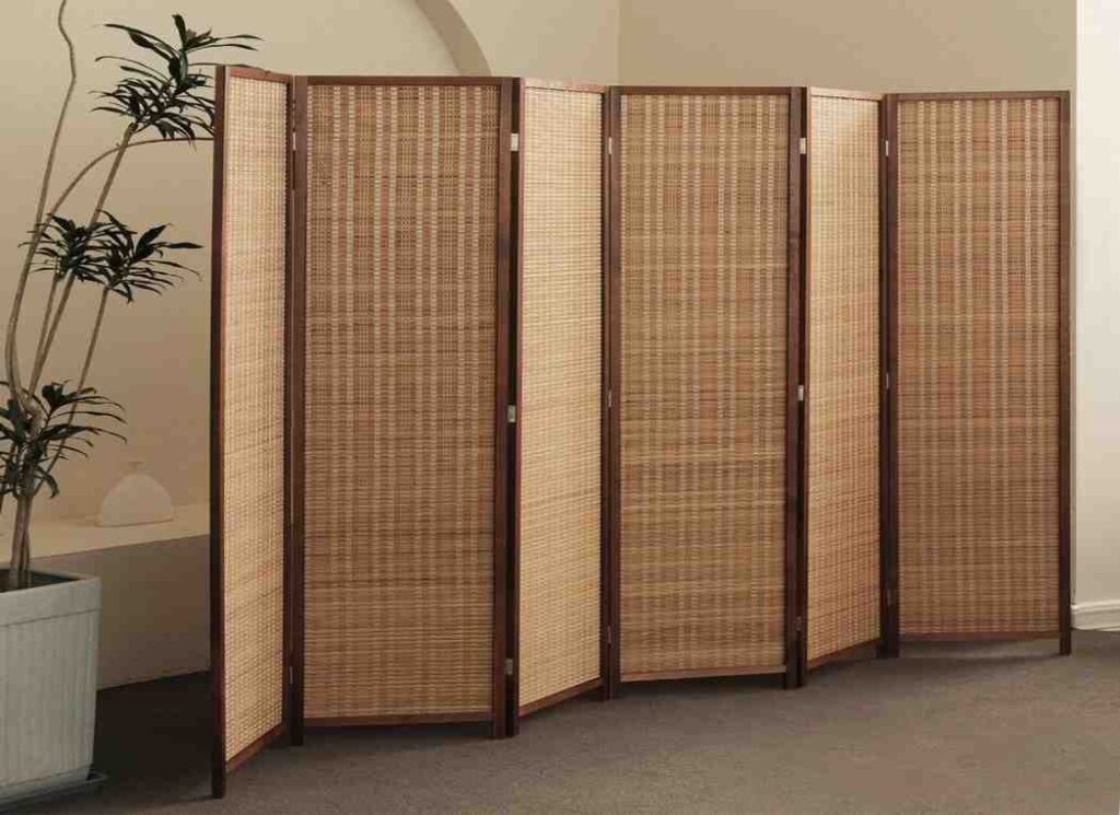 The sound proof room divider is tall and wide.